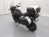 a black and white motorcycle parked in a white room