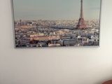 a picture hanging on the wall of a living room