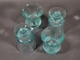 three glasses sitting next to each other on a table