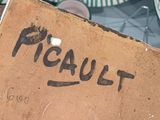 a person holding a box with the word peanut written on it