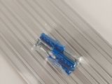 a blue toothbrush sitting in a clear plastic container