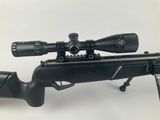 a rifle with a scope and a scope scope on a white background