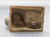 an image of a bronze sculpture of a bear with a hole in it ' s mouth