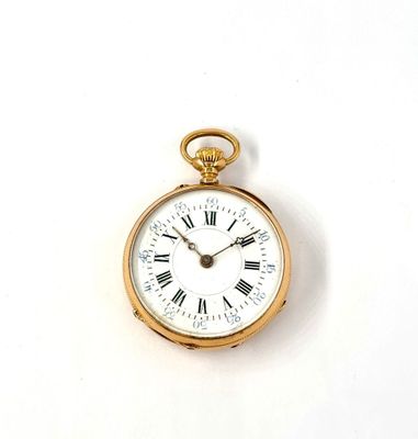 a gold pocket watch with roman numerals on the face