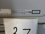 a hand that is holding a piece of paper with a number on it