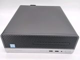 the dell desktop computer is sitting on a white surface
