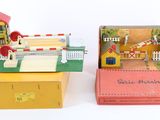 two boxes that have different types of toys inside of them