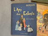 several children ' s books are sitting on the floor next to each other