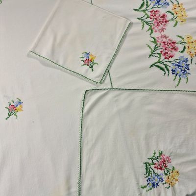a white sheet with a bunch of flowers on it