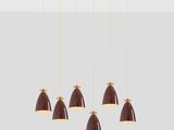 a set of six brown and gold pendant lights hanging from a ceiling