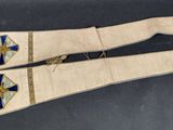 two pieces of white cloth with blue and gold designs on them