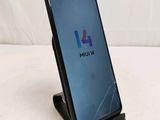 a close up of the front and back of a black samsung note 10 smartphone