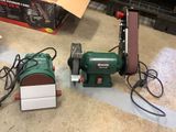a machine that is sitting on the floor next to a box