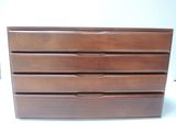 a picture of a wooden dresser with four drawers