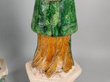 pair of ceramic figurines of a man and woman