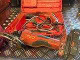 a red tool box with tools in it sitting on a table