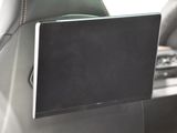 a lap top in the back seat of a car