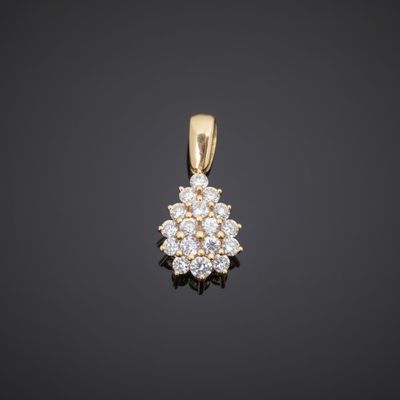 an 18k yellow gold diamond cluster pendant
