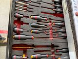many different tools in the case on the table