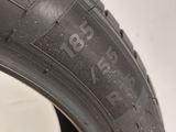 a close up of a tire on a white surface