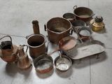 many pots and pans on the floor next to each other