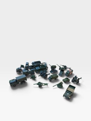a lot of toy military vehicles on a white surface