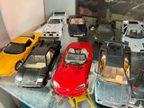a lot of toy cars that are sitting on a table
