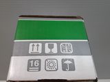 a box that has a green and white sign on it