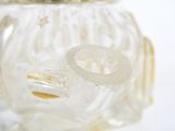 a glass vase with a ring on top of it