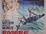 une vieille affiche de cinéma représentant une femme en kayak sur l'eau