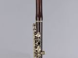 a close up of a flute on a table with a white background