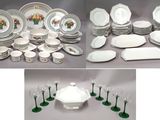 many different types of plates and glasses on the table