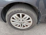 a close up of a tire on the side of a car