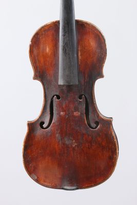 an old violin with a bow on a white background