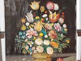 une peinture de fleurs dans un vase sur un chevalet