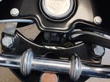 a close up of a motorcycle ' s headlight and handlebars