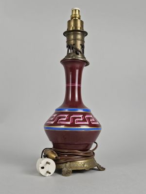 an image of a red and blue vase with a light on it