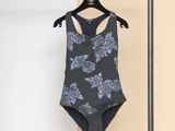 the back of a bathing suit hanging on a clothes rack