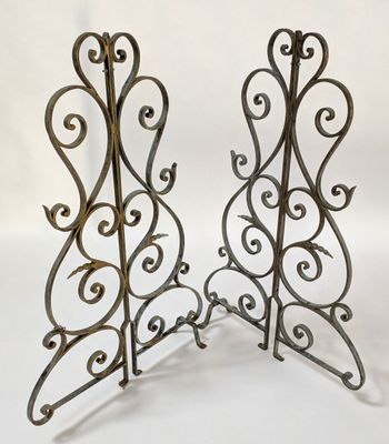 pair of antique wrought iron candle holders with scroll designs