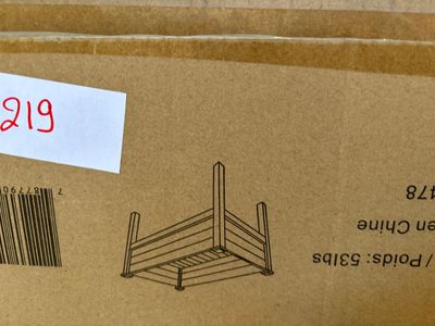 a cardboard box with a picture of a wooden chair on top of it