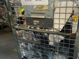 a large metal cage with a lot of items in it