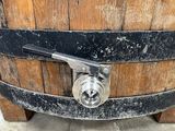 a wooden barrel with a metal latch on it
