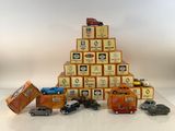 many toy cars that are stacked on top of each other