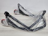 pair of black and red motorcycle handlebars on a wooden table