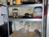 a refrigerator and a refrigerator freezer in a dirty room