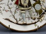 a plate with a picture of a man and a dog on it