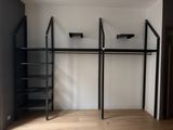 an image of a closet with a ladder and shelves