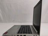 a laptop that is sitting on a white surface