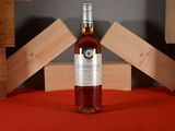 a bottle of wine that is sitting on a table