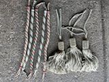 a picture of a rope and a pair of scissors on the ground